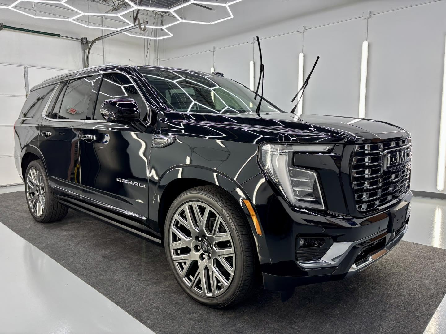 Clean black SUV with a glossy exterior after vehicle detailing