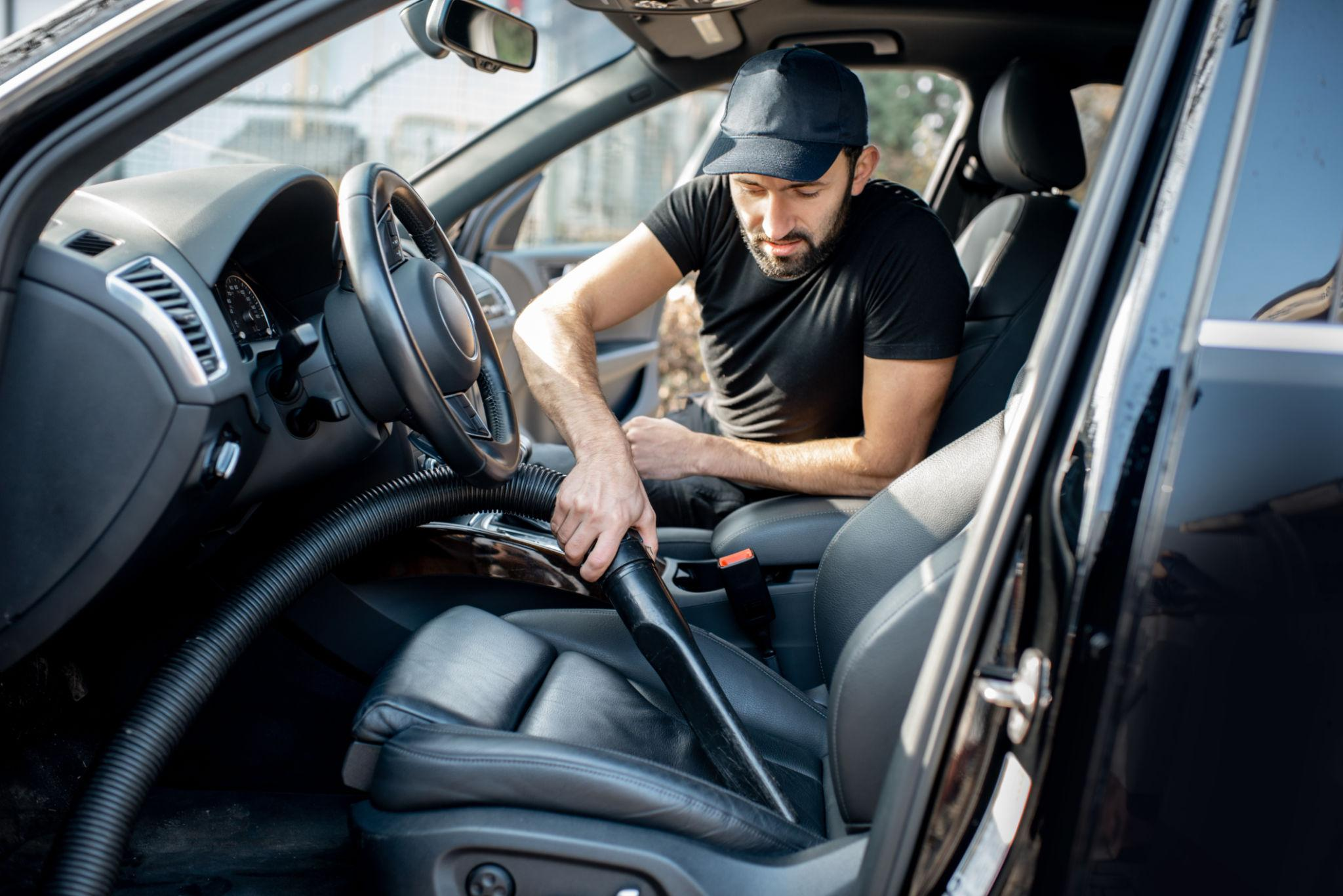 Professional interior car cleaning and vacuuming after a Houston road trip